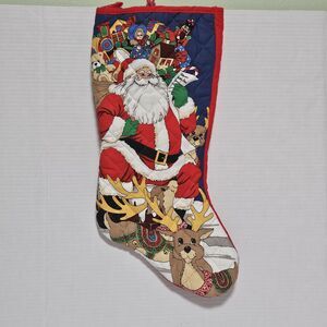 Vintage quilted Christmas stocking featuring Santa Claus and reindeer 1990s